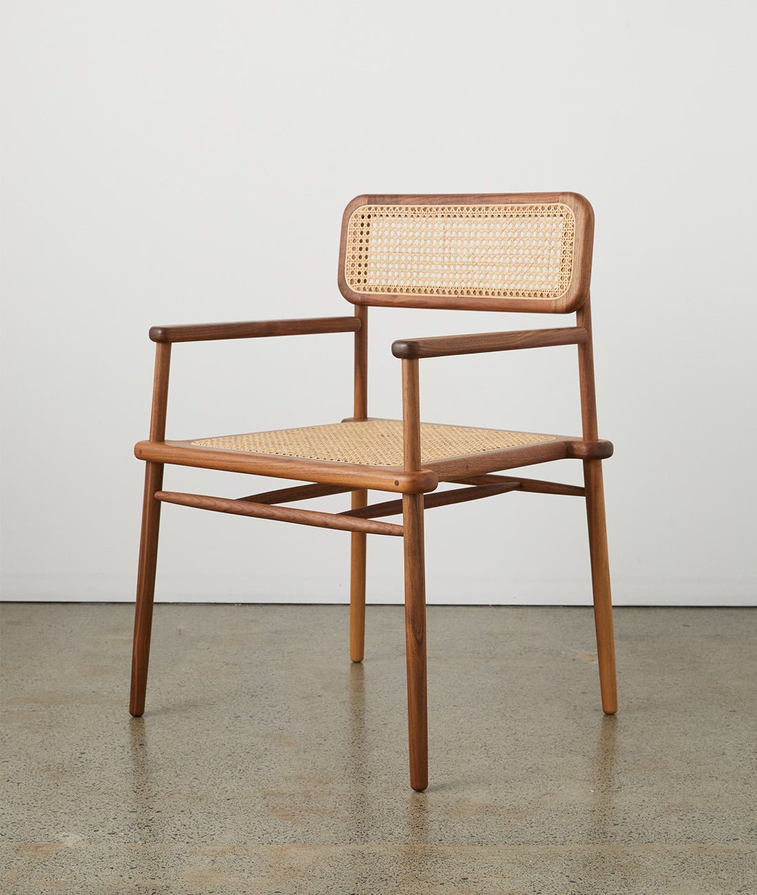JuneDiningChairwithArmrest10.jpg Mandor Sleek Cane Dining Chair — Teak Finish - Image 1